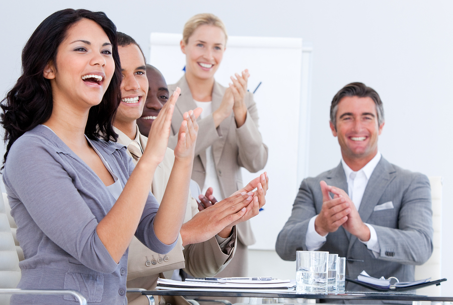 Audience using Padgett electronic voting system keypads during a live meeting